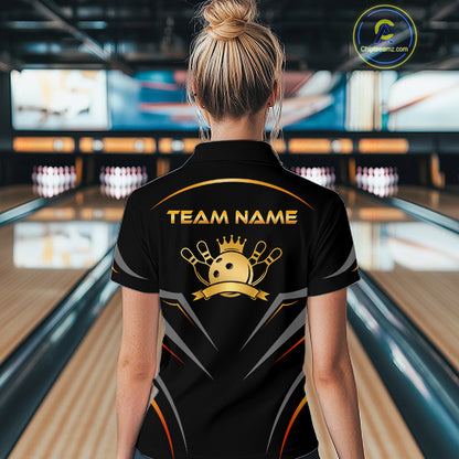 Person wearing a black bowling shirt with 'TEAM NAME' on the back in a bowling alley.