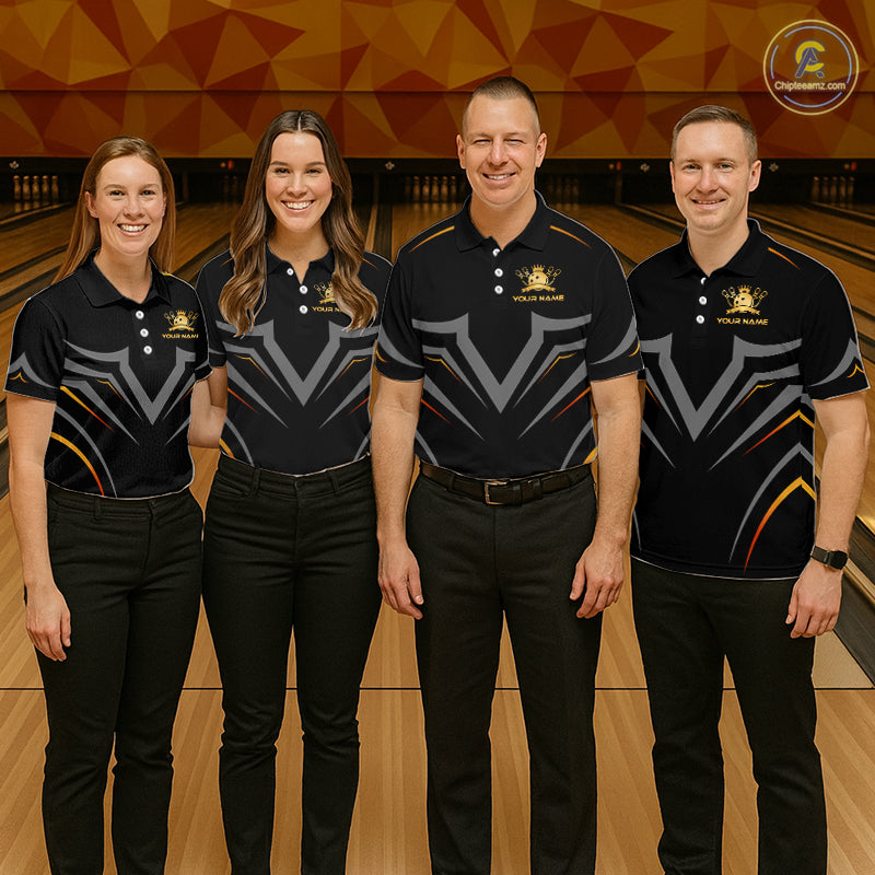 Four individuals in matching bowling team shirts standing on a bowling alley.