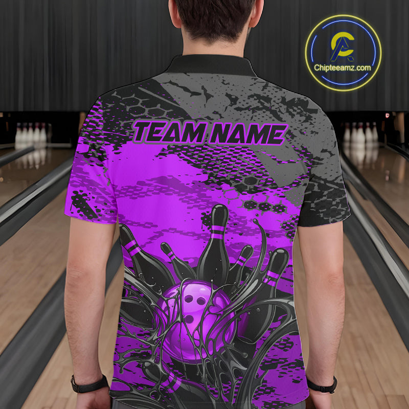 Person wearing a bowling shirt with a purple and black design in a bowling alley.