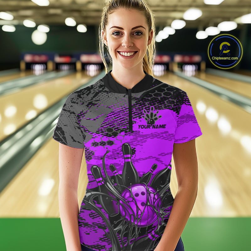 Woman wearing a custom bowling shirt with a design and text in a bowling alley.
