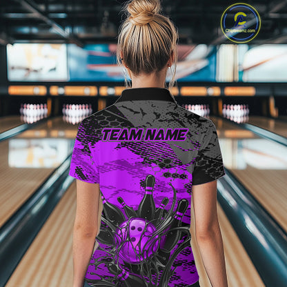 Person wearing a purple and black bowling shirt with 'TEAM NAME' text in a bowling alley.