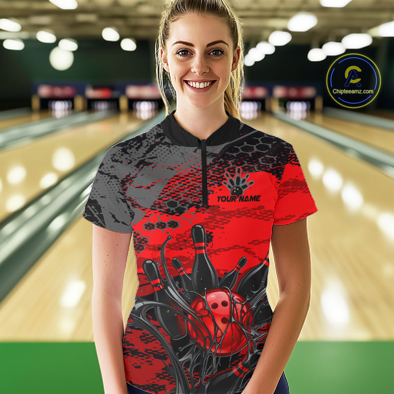 Woman wearing a red and black bowling shirt with a personalized name on a bowling alley background