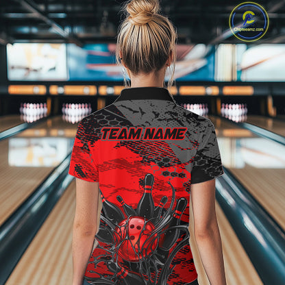 Person wearing a custom bowling shirt with 'TEAM NAME' text in a bowling alley.