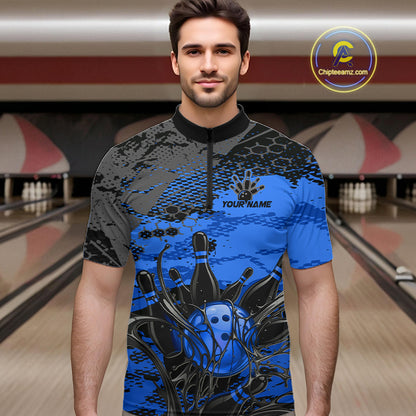 Man wearing a blue and black bowling shirt with a personalized design in a bowling alley.