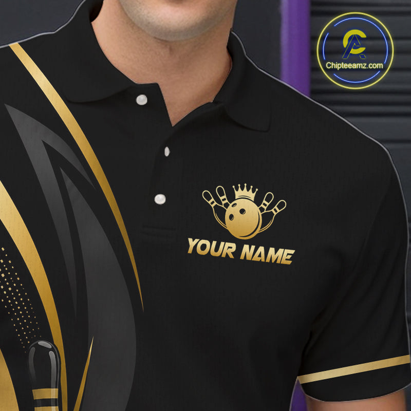 Black polo shirt with gold logo and text on a blurred background