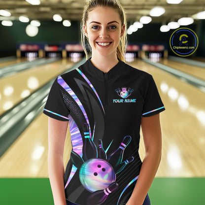 Person wearing a custom bowling shirt with a colorful design in a bowling alley.