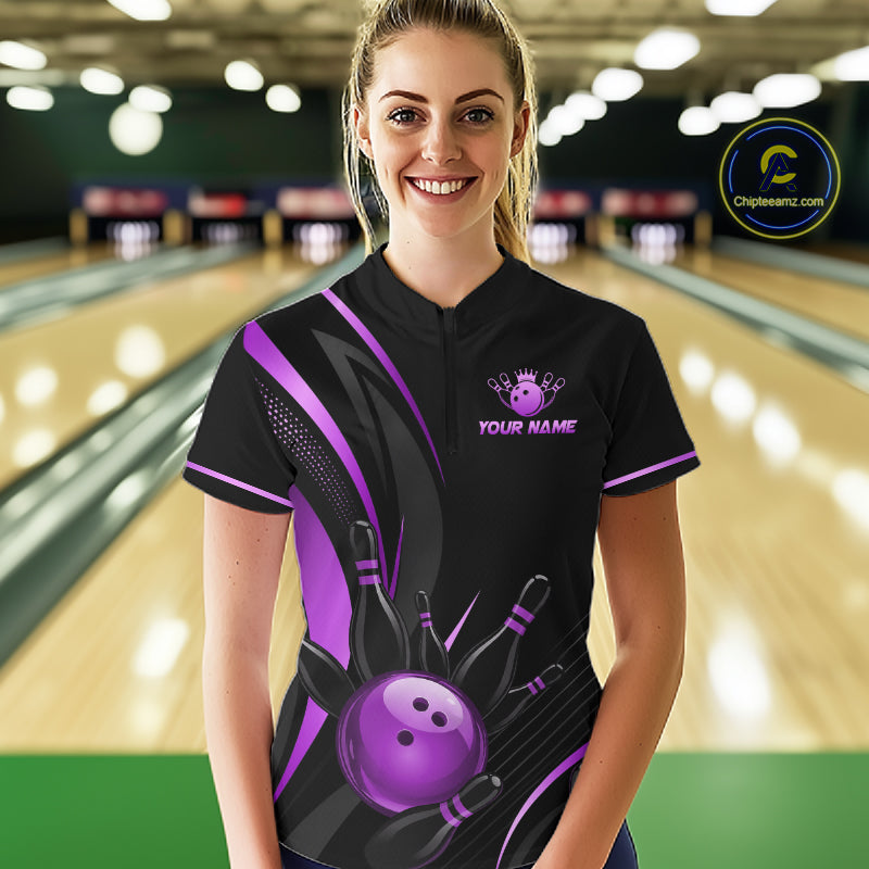 Person wearing a personalized bowling shirt with a purple design in a bowling alley.