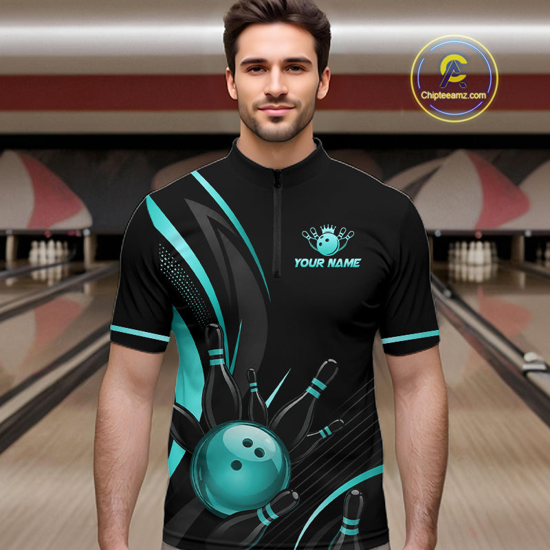 Man wearing a black and teal bowling shirt with a personalized name on a bowling alley background