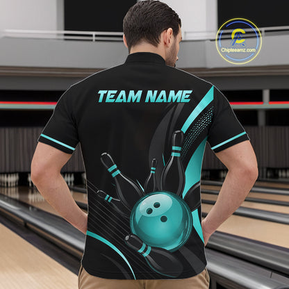 Person wearing a black bowling shirt with a blue design and 'TEAM NAME' text at a bowling alley.