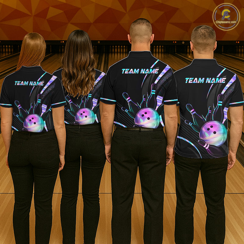 Four people wearing black bowling shirts with colorful designs on a bowling alley.