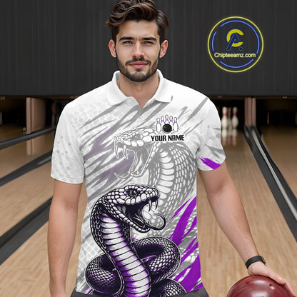 Man wearing a bowling shirt with snake design in a bowling alley, holding a bowling ball.