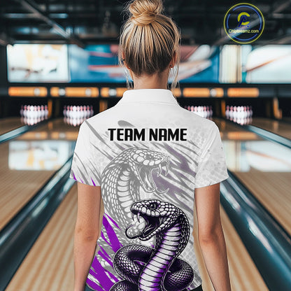 Person wearing a shirt with a snake design and 'TEAM NAME' text in a bowling alley.