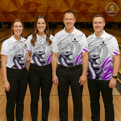 Four people wearing matching bowling shirts with snake designs on a bowling alley.