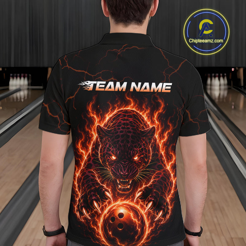 Person wearing a black t-shirt with a fiery panther design and 'TEAM NAME' text in a bowling alley.