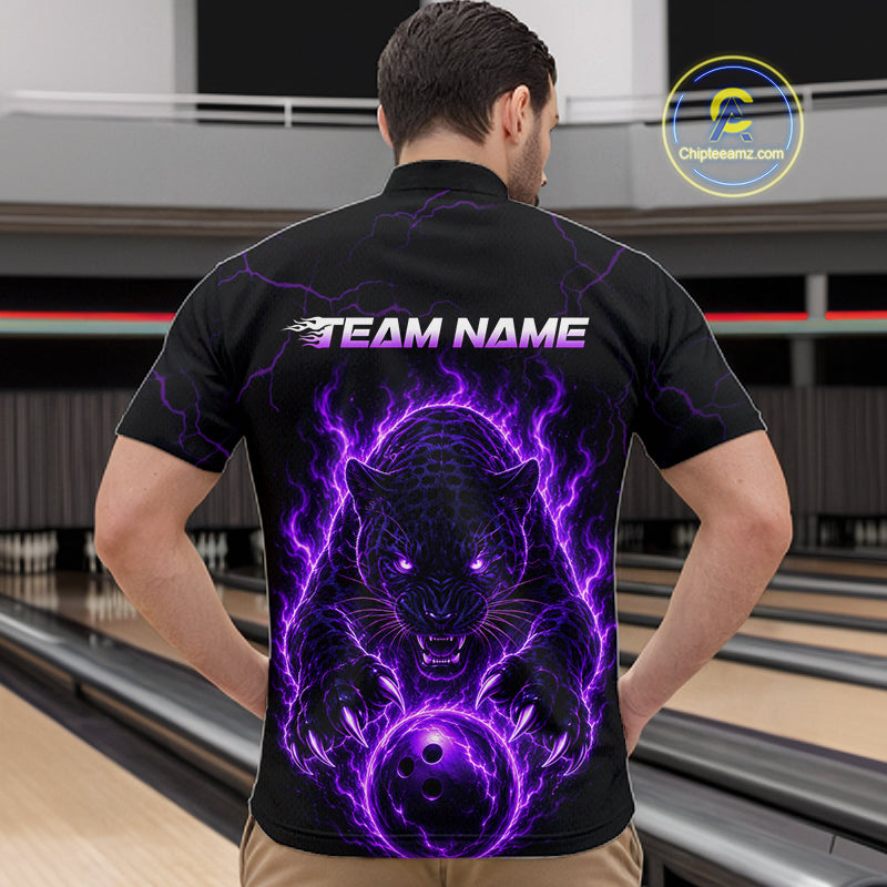 Person wearing a black t-shirt with a purple panther design on the back, standing in a bowling alley.