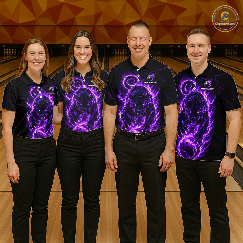 Four people wearing black shirts with purple graphics on a bowling alley.