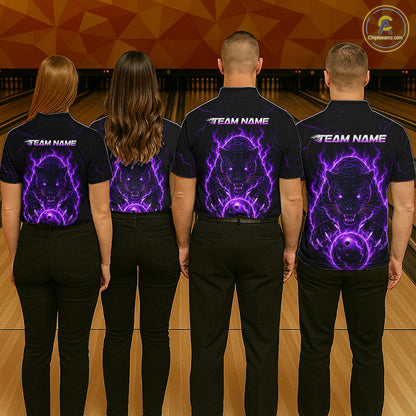 Four people wearing black shirts with a purple and white design on a bowling alley.