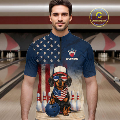 Man wearing a blue bowling shirt with a dog design and American flag in a bowling alley.