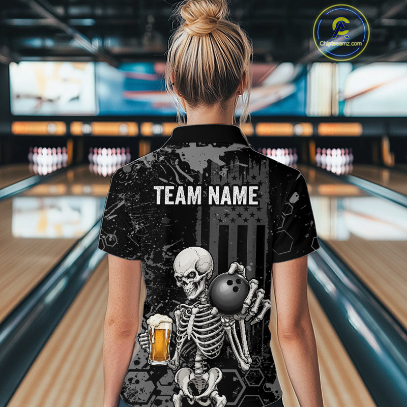 A woman viewed from behind wearing a black short-sleeve bowling-themed polo shirt with a large skeleton graphic holding a bowling ball and beer glass, and the text 'TEAM NAME' printed across the back. Bowling lanes are visible in the background, and a circular 'CustomPolio.
