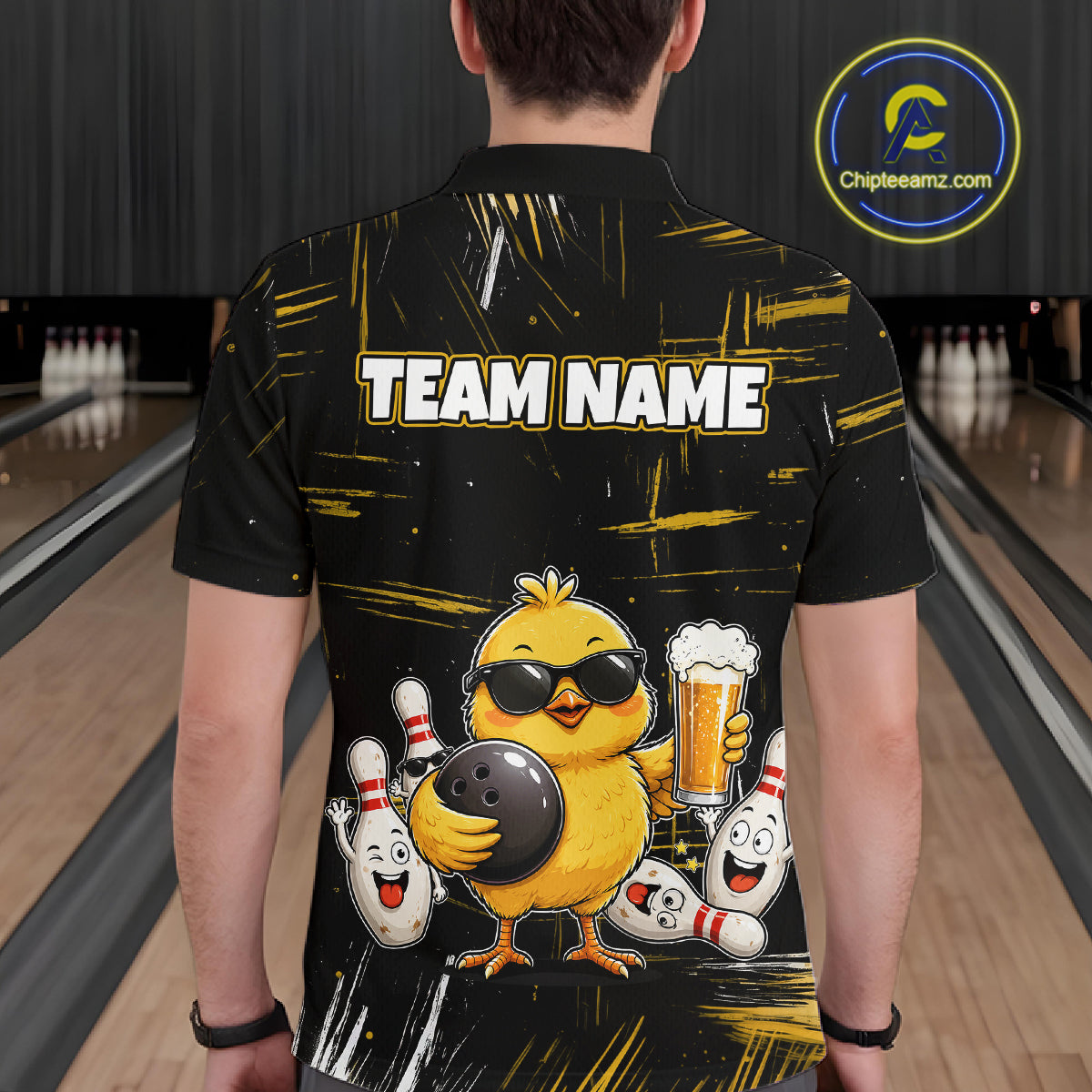 Man wearing a black bowling polo featuring a sunglasses-wearing yellow chick holding a bowling ball and beer, surrounded by smiling bowling pins, with personalized name and team name text.