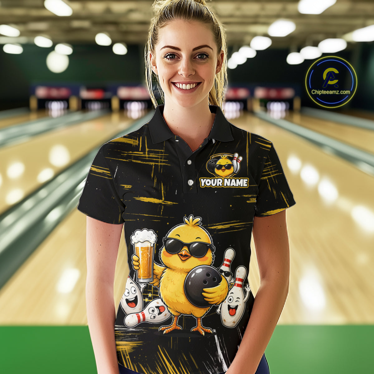 Women wearing bowling polo shirt featuring a chick holding a bowling ball surrounded by smiling pins and beer graphics on black yellow background.