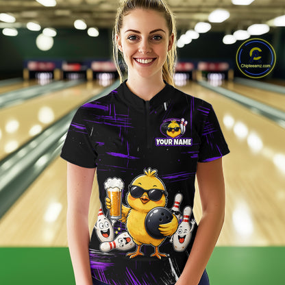 Women wearing bowling quarter zip shirt featuring a chick holding a bowling ball surrounded by smiling pins and beer graphics on black yellow background.
