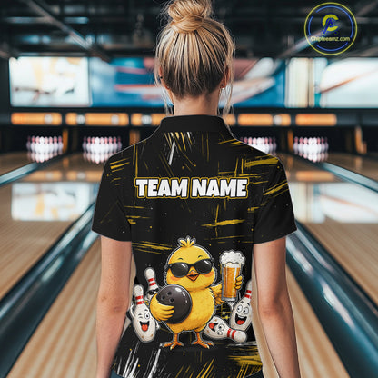 Women wearing bowling polo shirt featuring a chick holding a bowling ball surrounded by smiling pins and beer graphics on black yellow background.