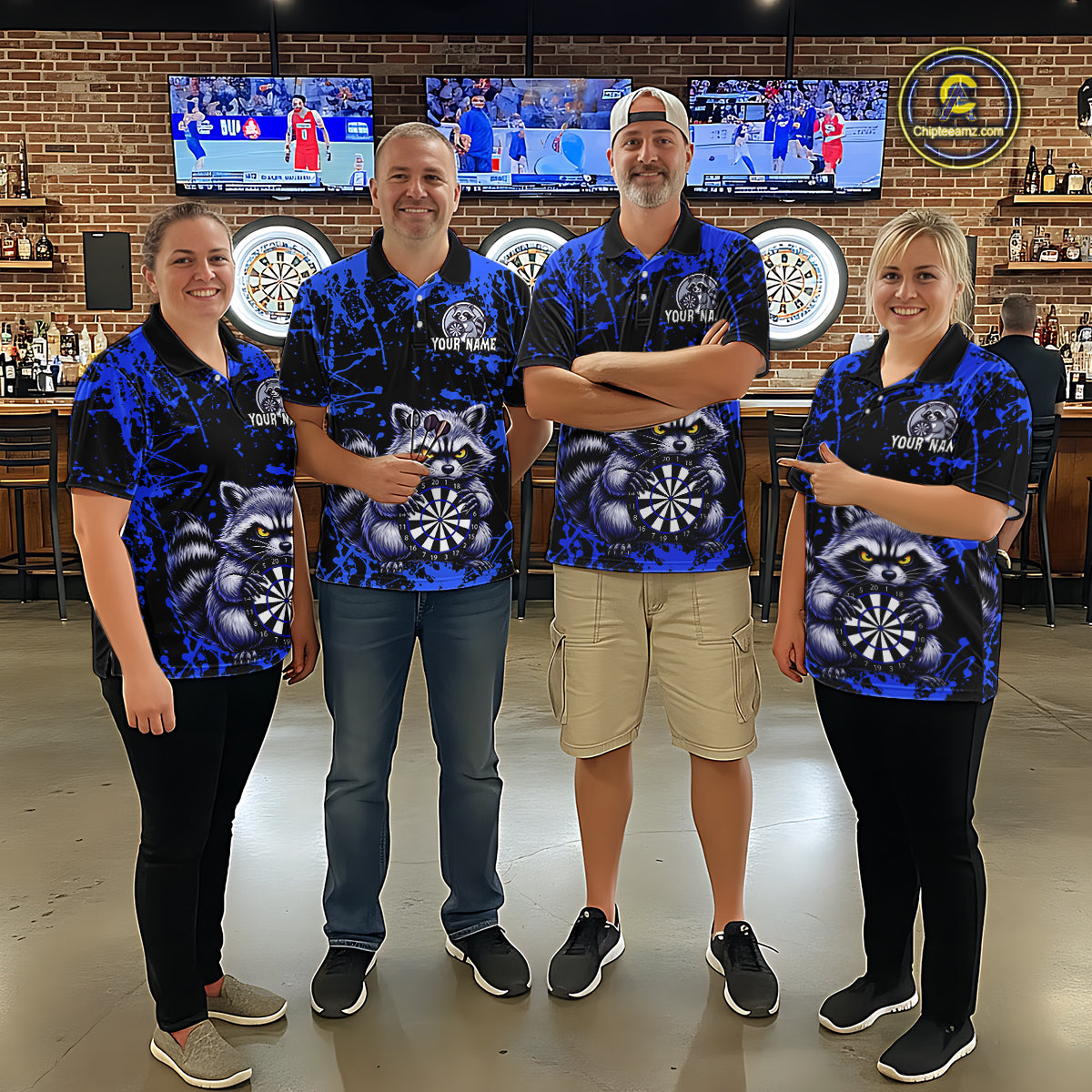 Four people in matching blue shirts with raccoon graphics standing in a bar setting.