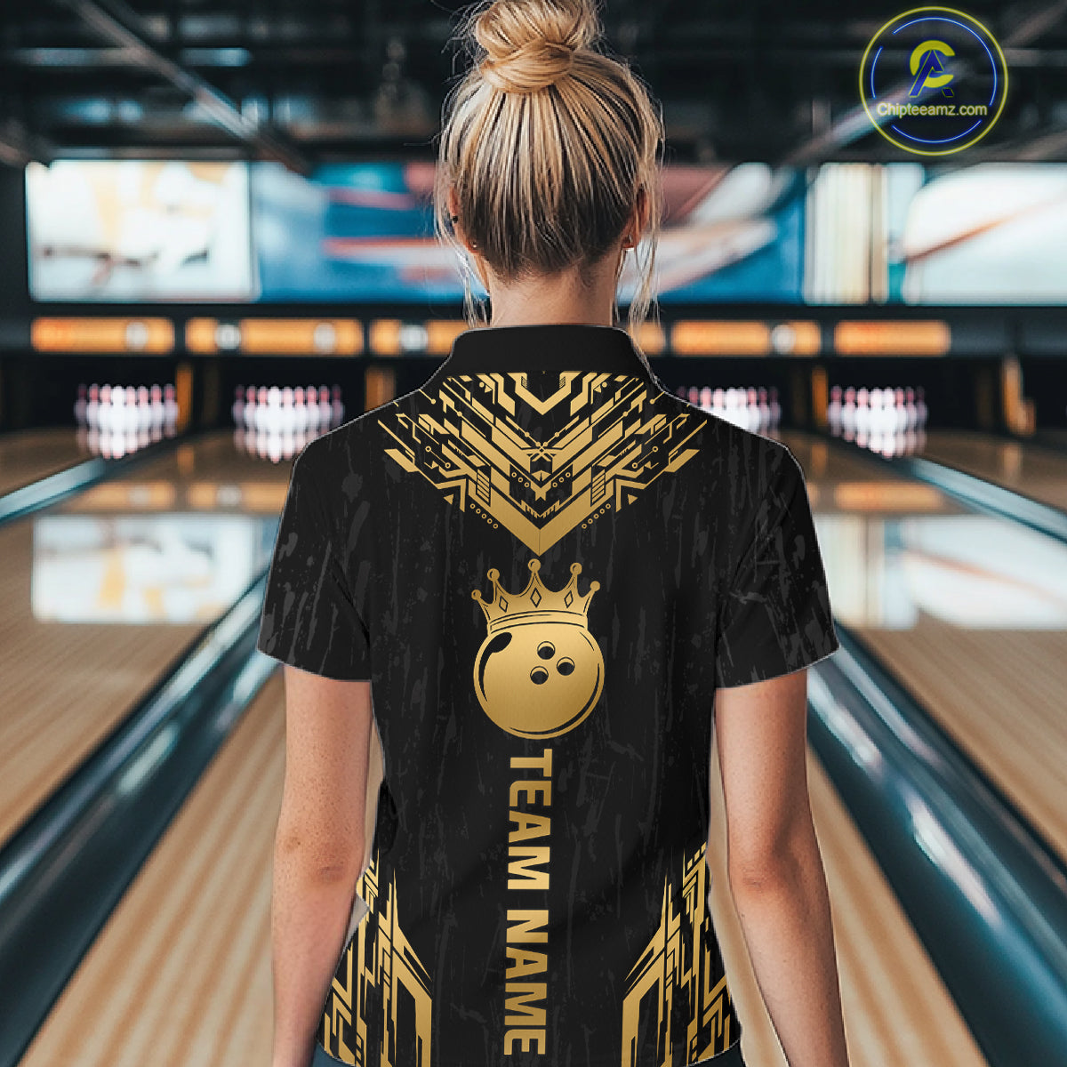 Women wearing personalized bowling quarter zip shirt with a crowned bowling ball centered among geometric gold patterns across a black layout.
