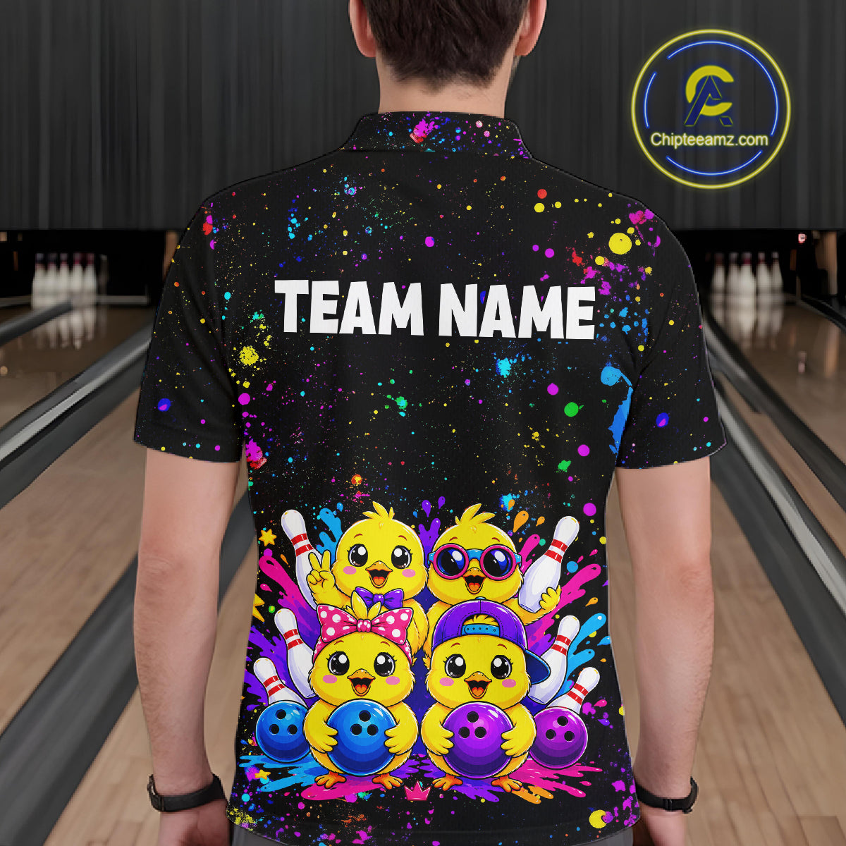 Men wearing personalized bowling polo shirt with cartoon chicks holding bowling balls, framed by pins and colorful paint patterns on a black layout.