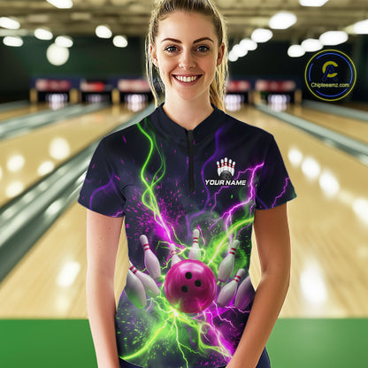 Women wearing personalized bowling quarter zip with pink ball, scattered pins, neon lightning, team name, and player name on black background