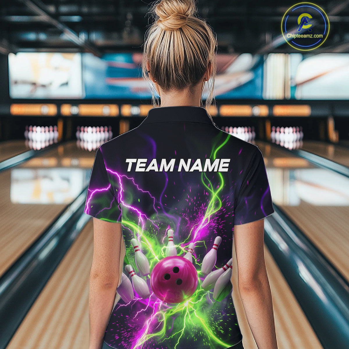 Women wearing personalized bowling quarter zip with pink ball, scattered pins, neon lightning, team name, and player name on black background