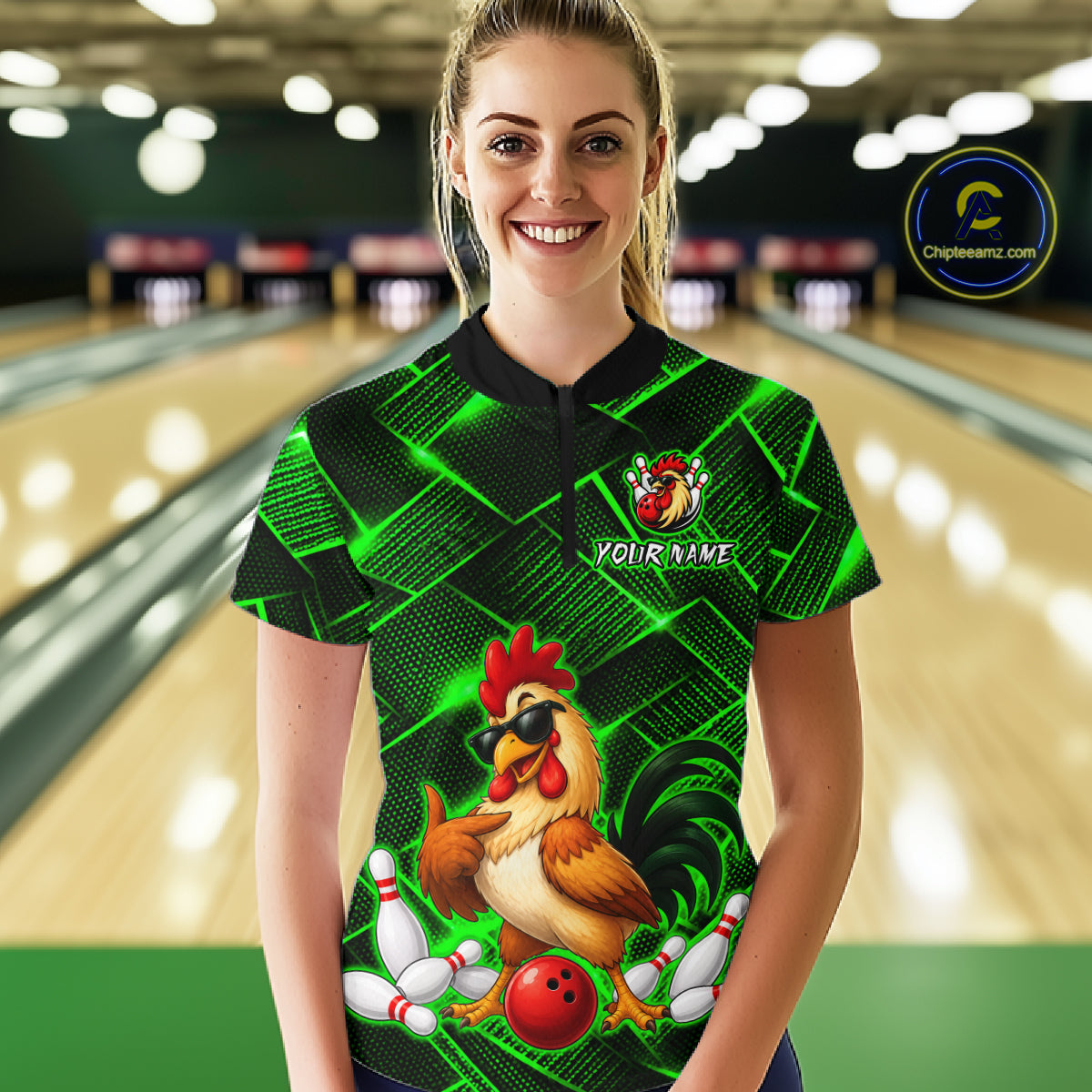 Woman wearing a green and black bowling quarter zip shirt featuring a cool rooster mascot wearing sunglasses, a red bowling ball, bowling pins, and custom your name text.