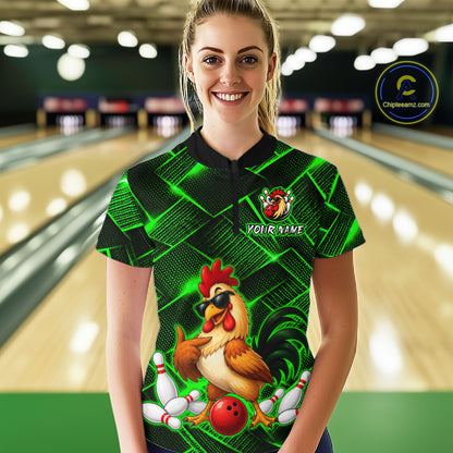 Woman wearing a green and black bowling quarter zip shirt featuring a cool rooster mascot wearing sunglasses, a red bowling ball, bowling pins, and custom your name text.