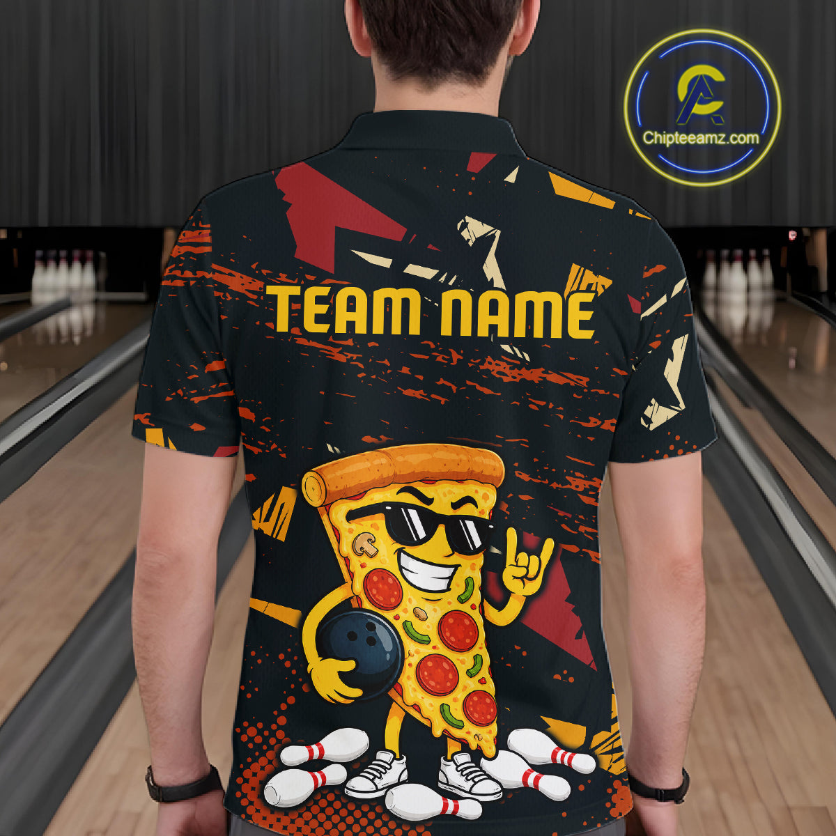 Man wearing a black bowling polo featuring orange grunge graphics, a sunglasses-wearing pizza slice mascot, bowling pins, and custom team name text.