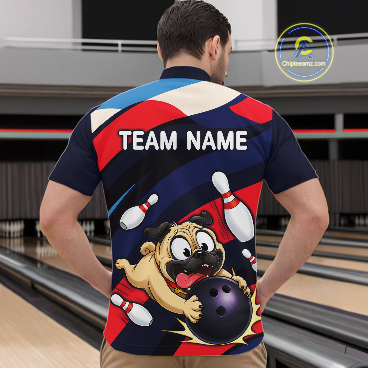 Man wearing a navy, red, and white bowling quarter zip featuring a cartoon pug holding a purple bowling ball, pins, and custom team name text.