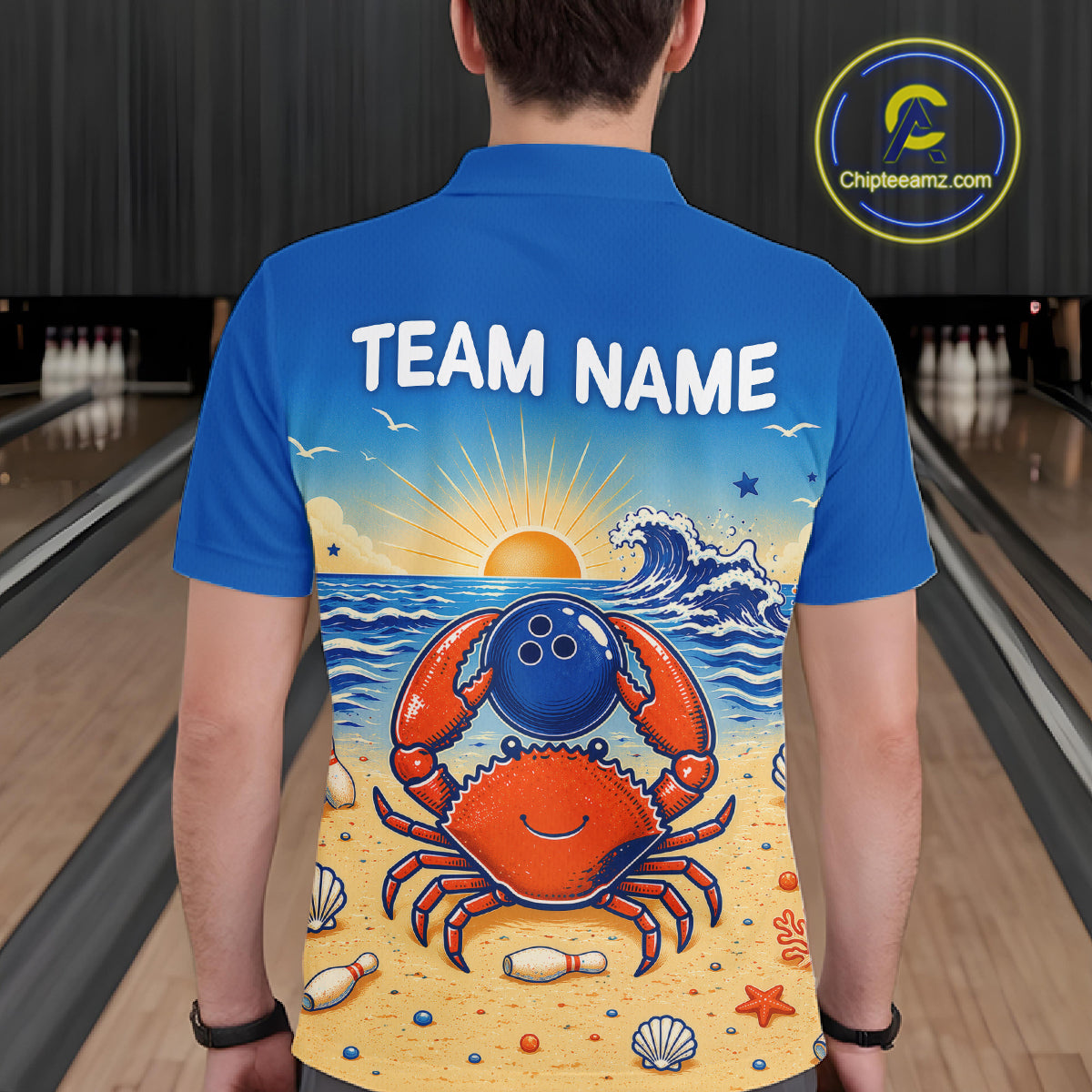 Person wearing a blue shirt with a colorful crab design and 'Team Name' text in a bowling alley.