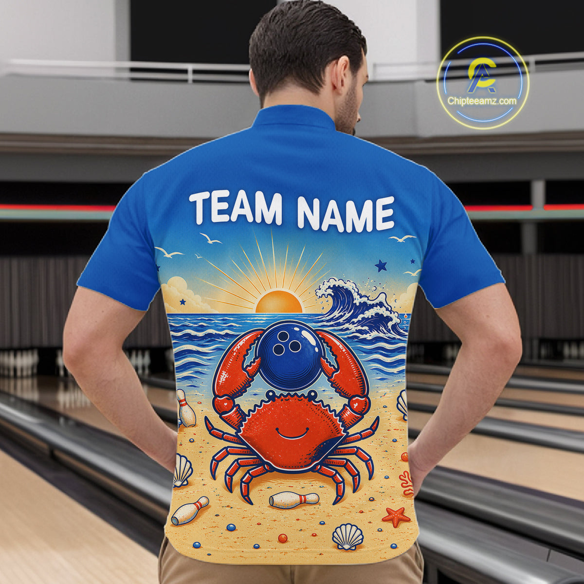 Man wearing a blue shirt with a colorful design of a crab holding a bowling ball on a beach, with 'TEAM NAME' text.