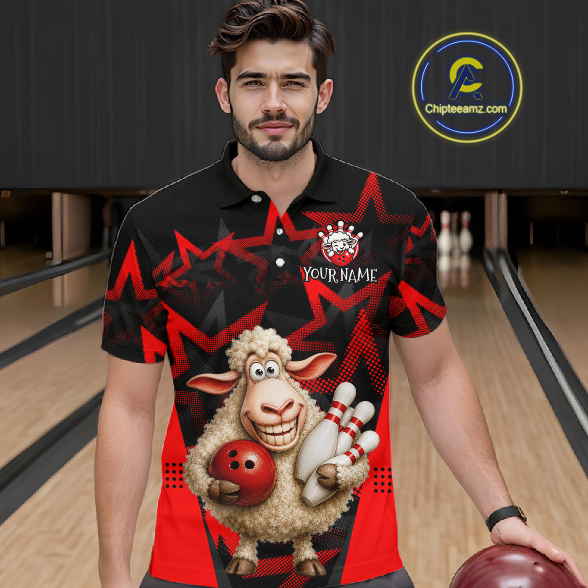 Man wearing a black and red shirt with a cartoon sheep holding a bowling ball and pins in a bowling alley.