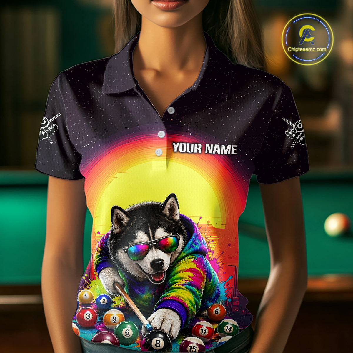 Person wearing a colorful polo shirt with a dog playing pool design, blurred background