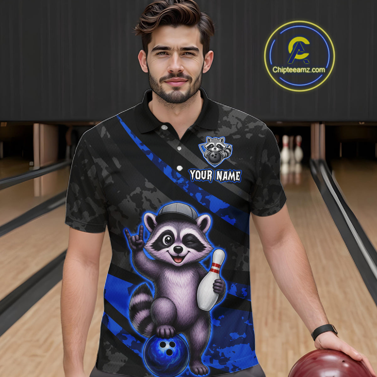 Man wearing a custom polo shirt with a raccoon graphic on a bowling alley.