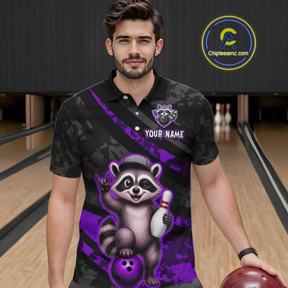 Man wearing a black and purple bowling shirt with a raccoon design on a bowling alley.
