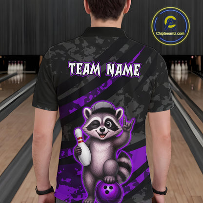 Person wearing a bowling shirt with a raccoon graphic and 'Team Name' text on a bowling alley background.