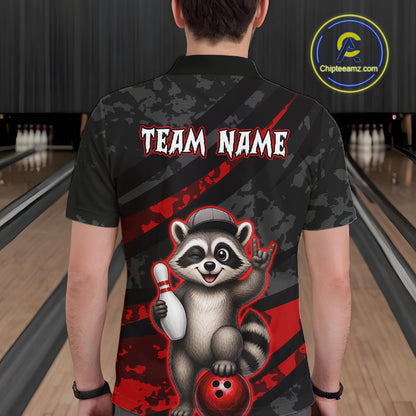 Person wearing a bowling-themed shirt with a raccoon graphic in a bowling alley.