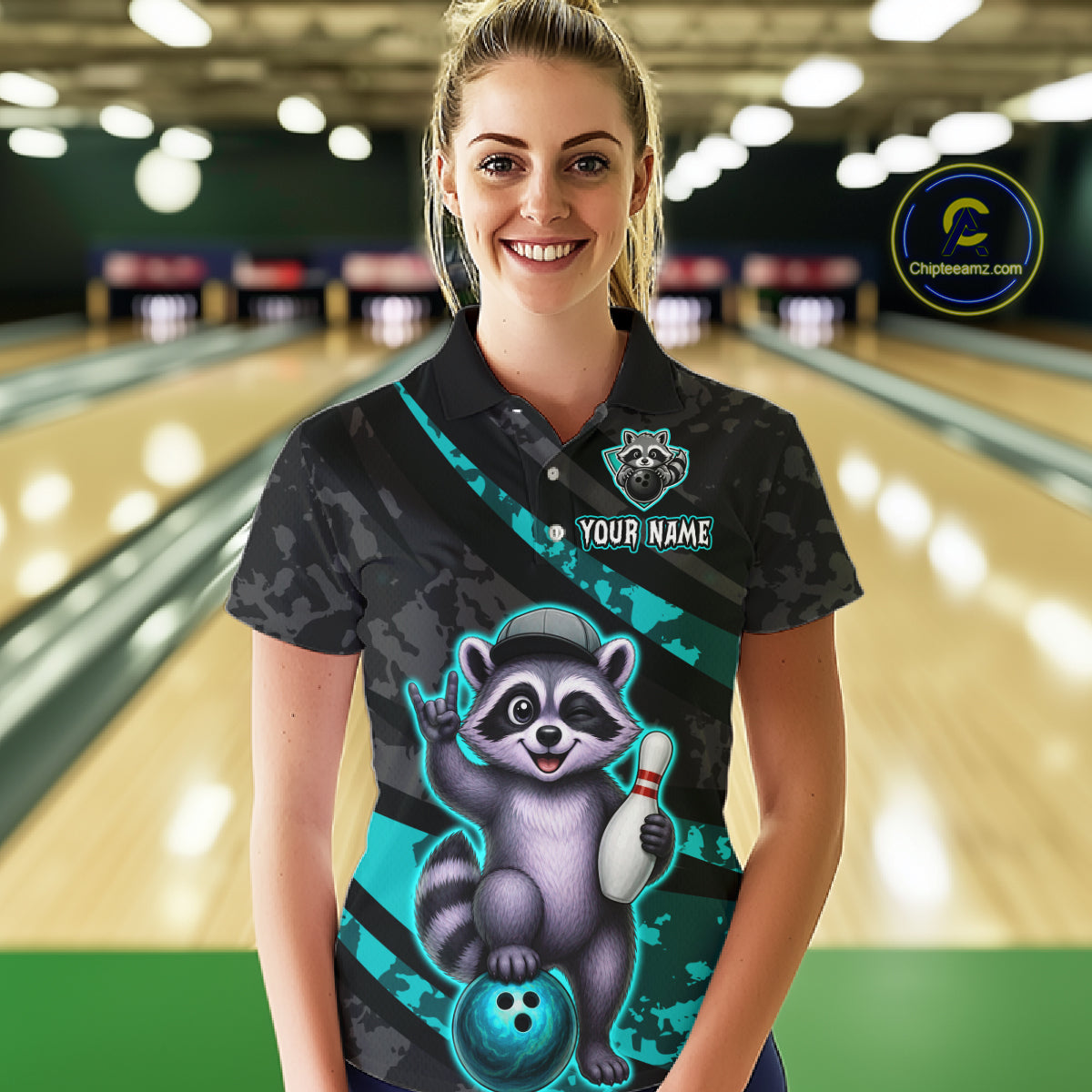 Person wearing a custom bowling shirt with a raccoon design in a bowling alley.