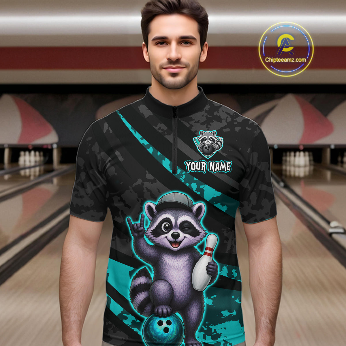 Man wearing a bowling shirt with a raccoon graphic in a bowling alley.