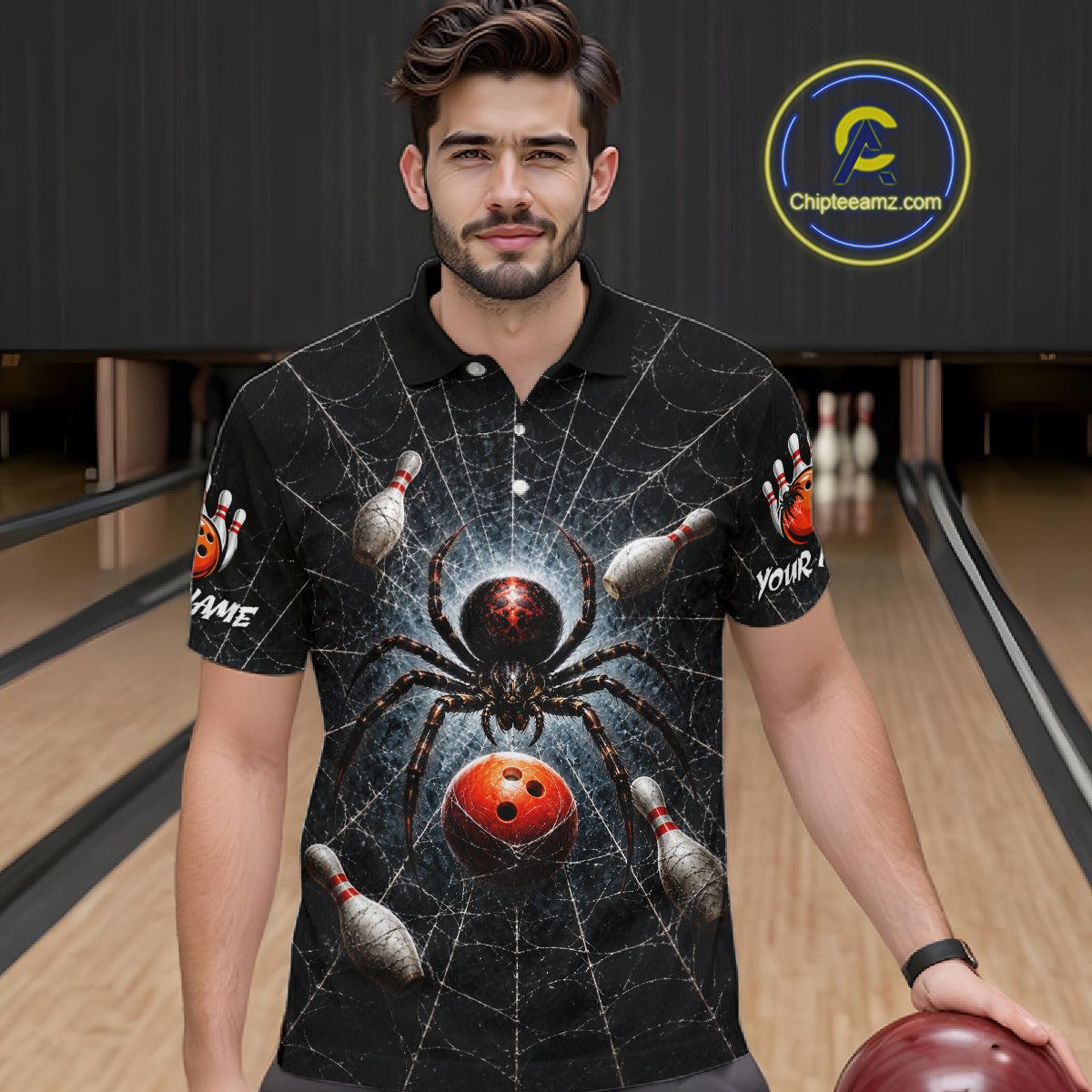 A man wearing a black short-sleeve polo shirt with a detailed bowling-themed spider graphic, standing in a bowling alley holding a bowling ball. The shirt features a large spider, bowling pins, and a red bowling ball on a web pattern.