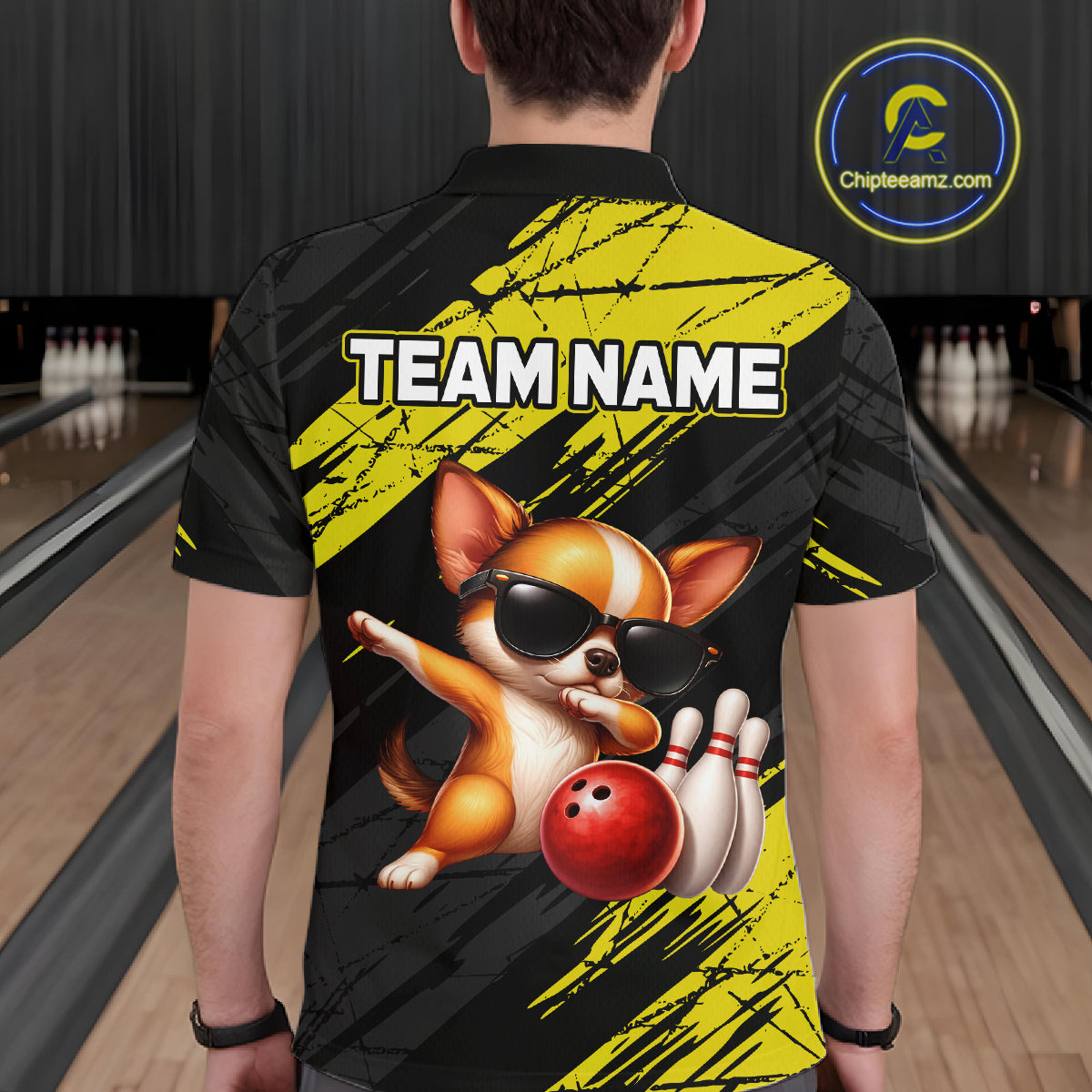 Person wearing a bowling shirt with a dog graphic and 'TEAM NAME' text in a bowling alley.