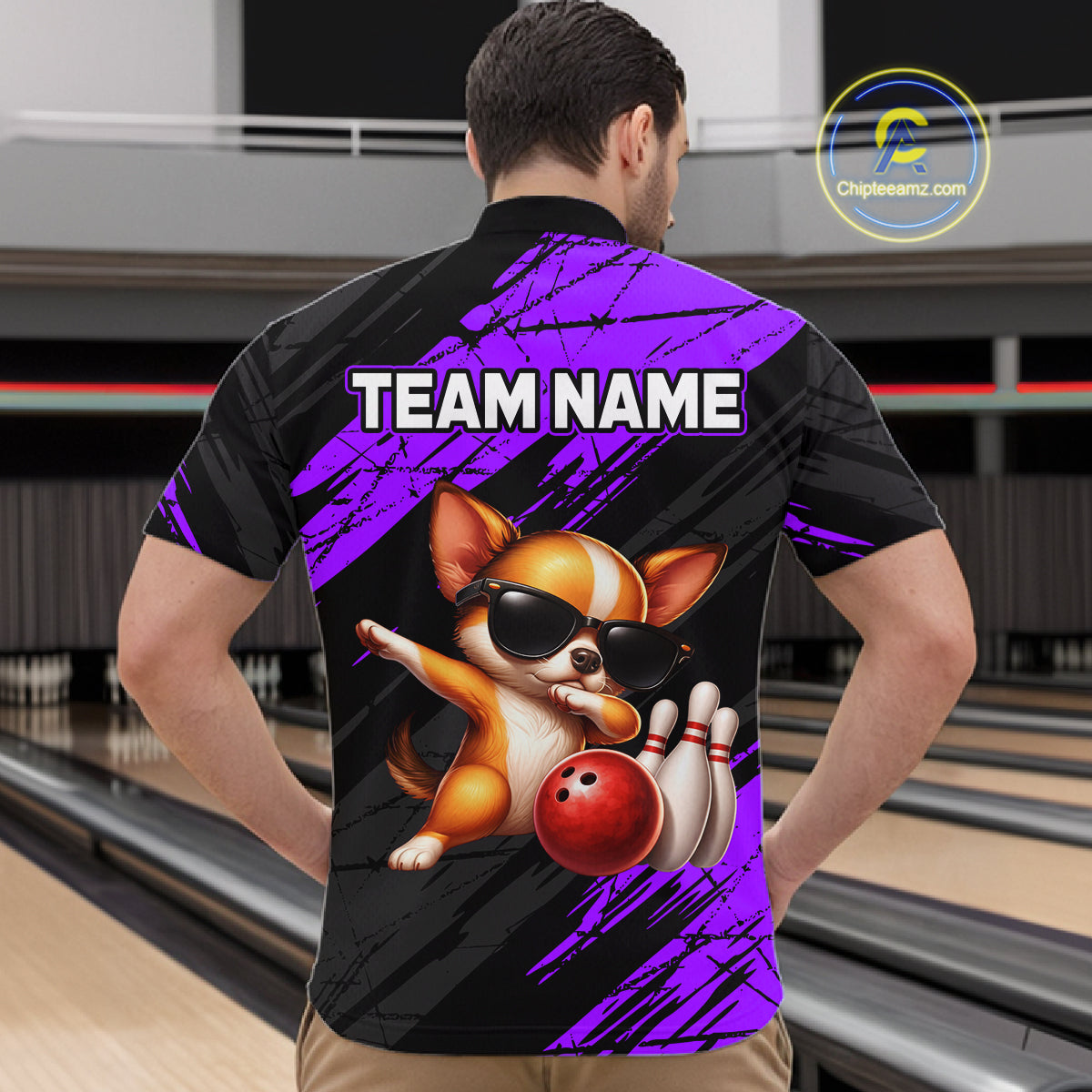 Person wearing a bowling-themed shirt with a dog graphic and 'TEAM NAME' text in a bowling alley.