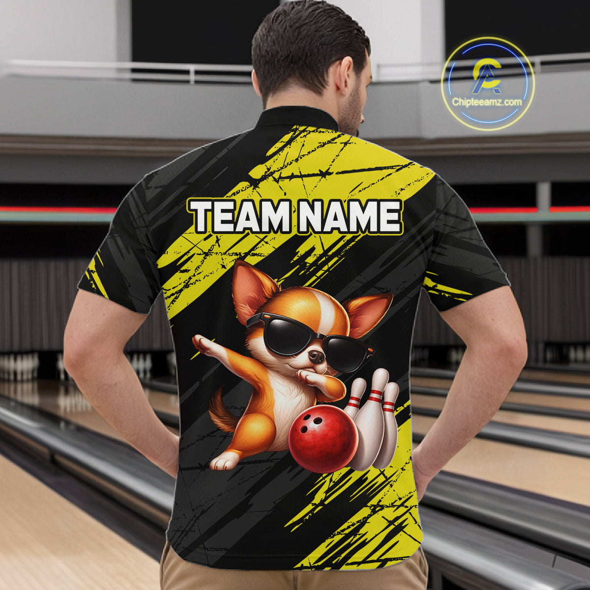 Person wearing a bowling-themed shirt with a dog graphic and 'TEAM NAME' text in a bowling alley.
